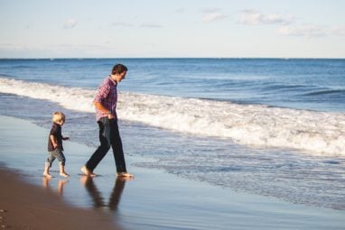 Dad and son on the beach