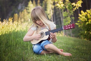 Girl playing the guitar