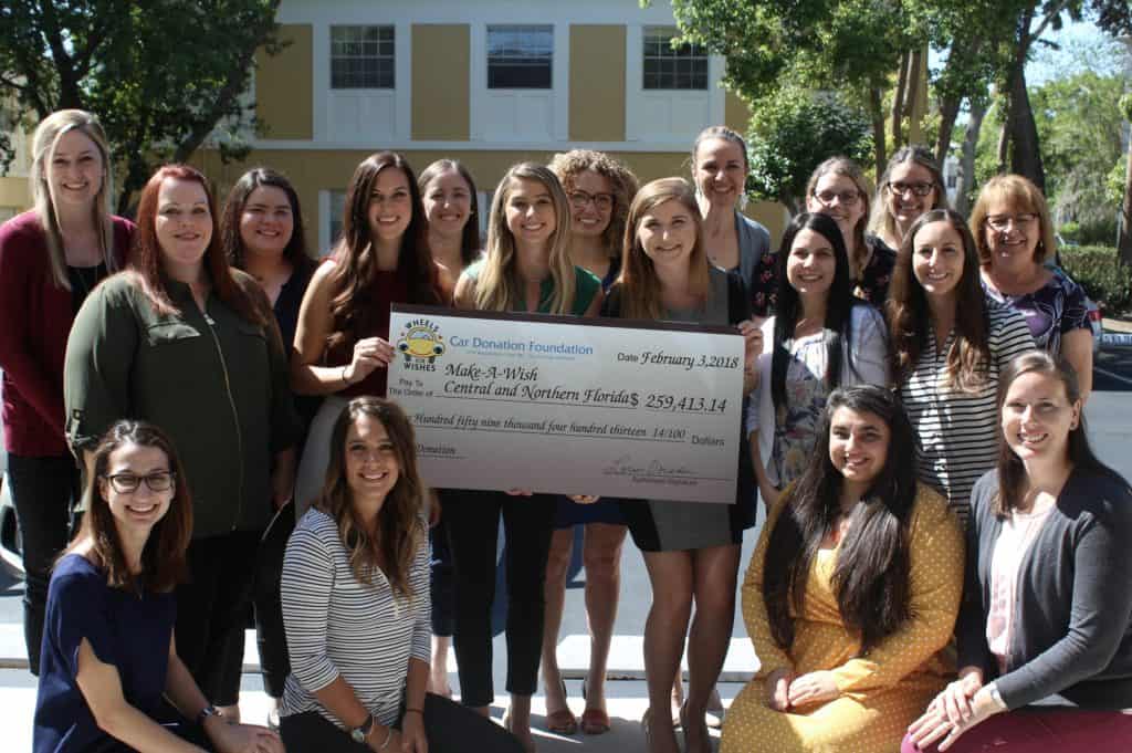 Make-A-Wish Central And Northern Florida Holding Check From Wheels For Wishes February 3, 2018