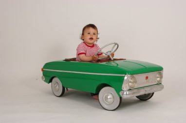 Child in photo driving car