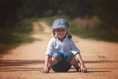 Boy in West Jordan, Utah on the road, smiling