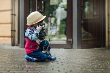 kid taking photo