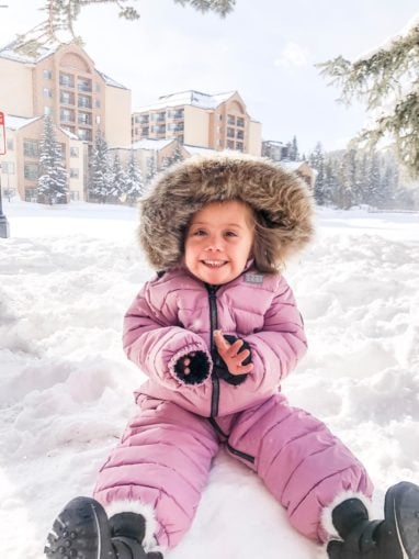 Make-A-Wish kid playing in the snow