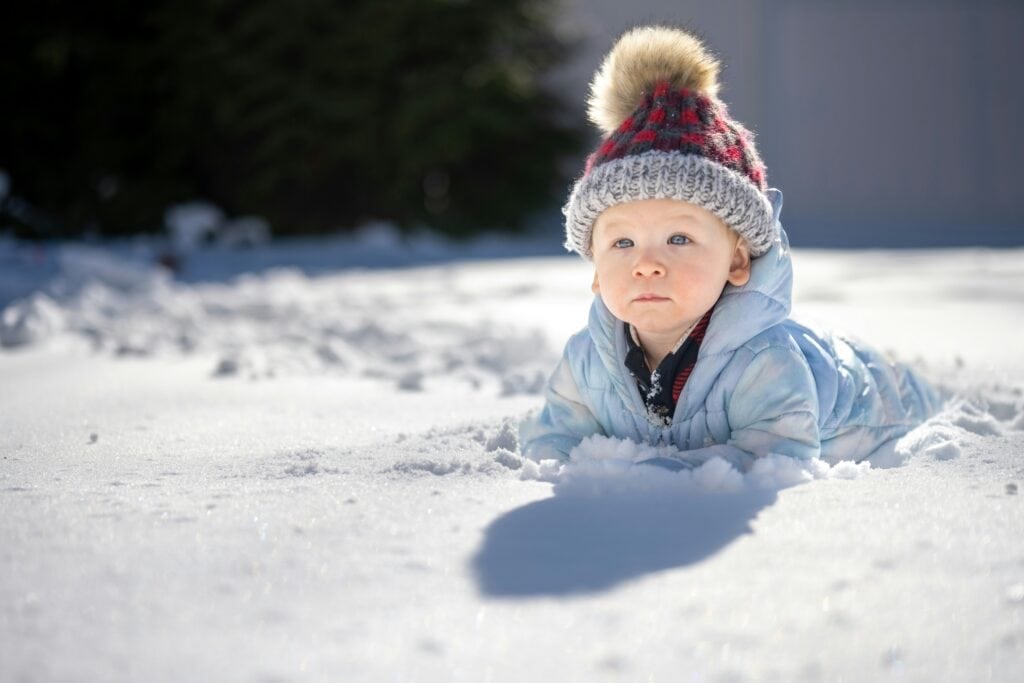 Happy baby in the snow in Connecticut
