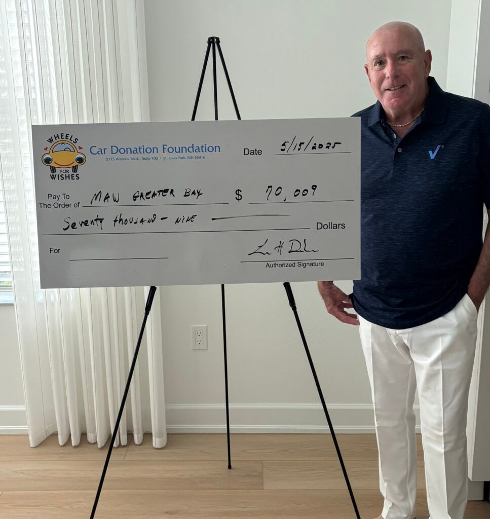 Car Donation Foundation presents a big check donation to children's charities.