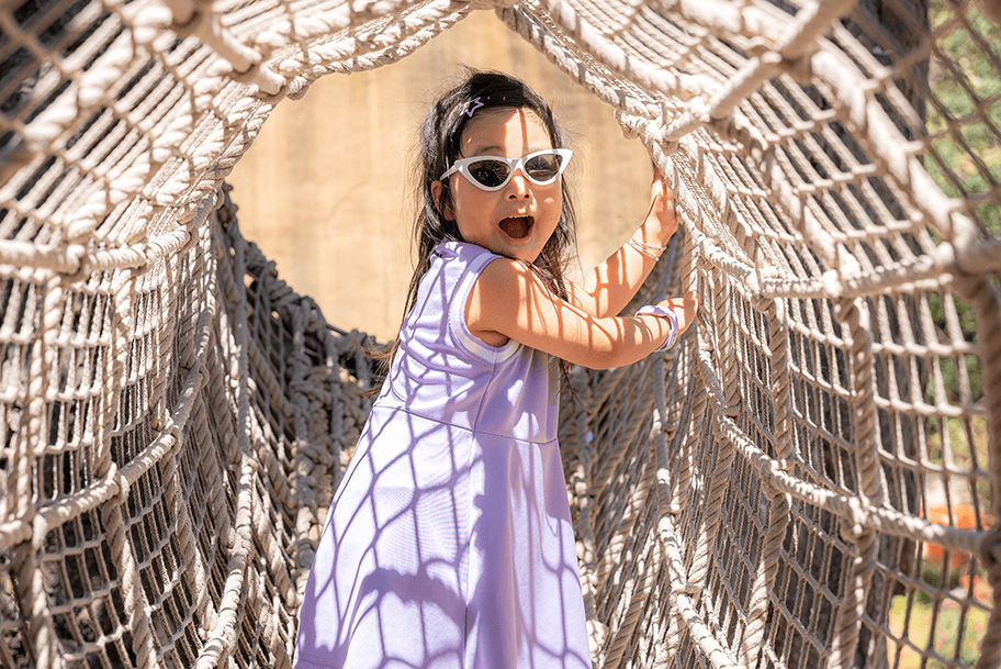 Girl child playing at playground in the Bay Area, California.