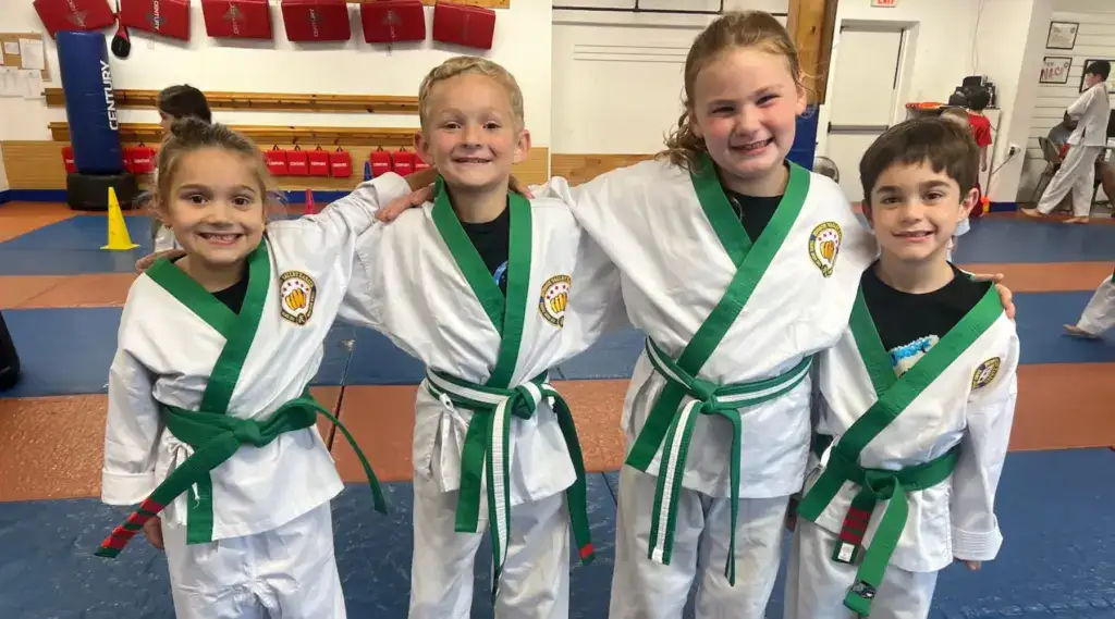 Hudson Valley kids in a karate class standing side by side.