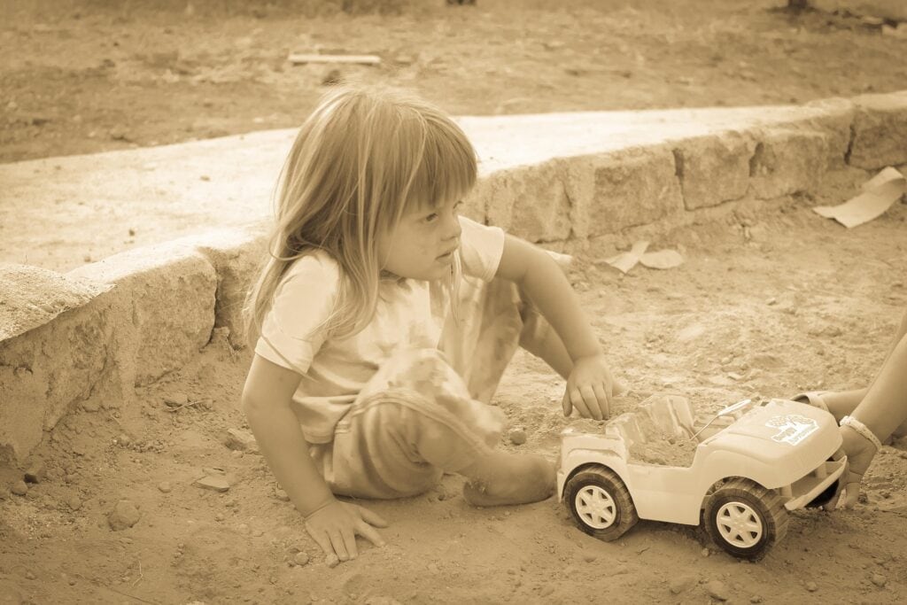 kid playing outside in Clarkstown, NY with toy car