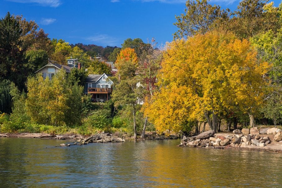 view of trees and a home from the water in Orangetown, NY