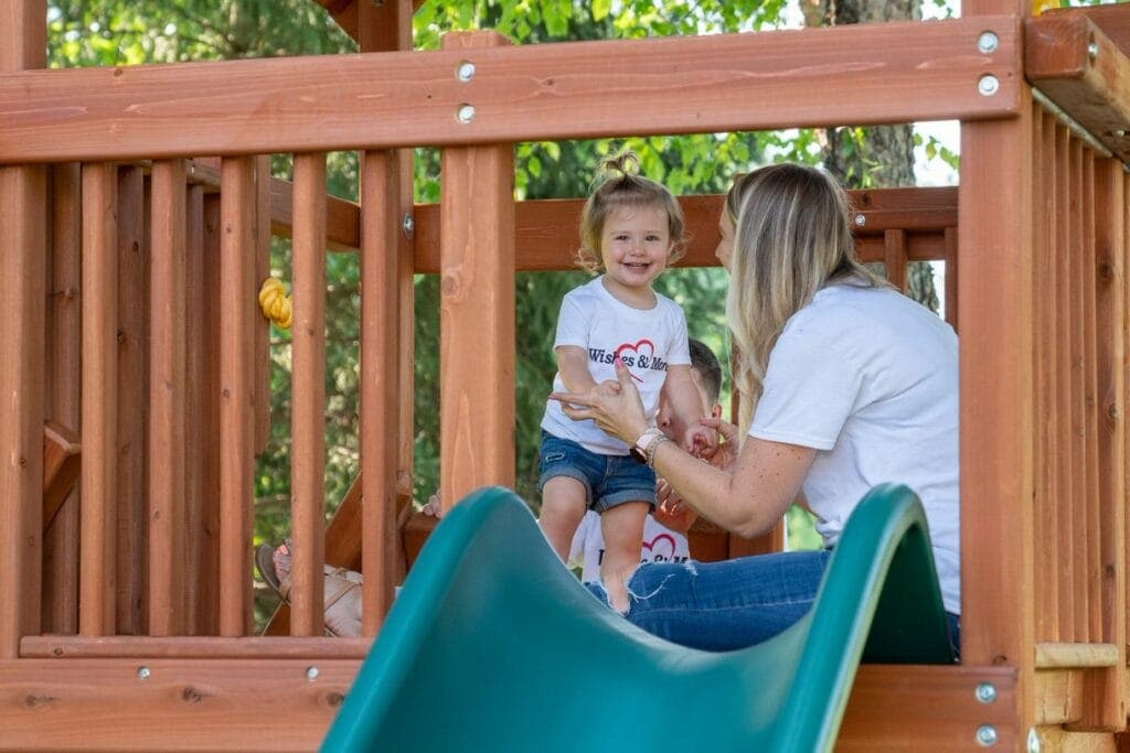 Woman and child playing on a playground