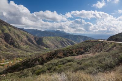 Mountains under a cloudy blue sky